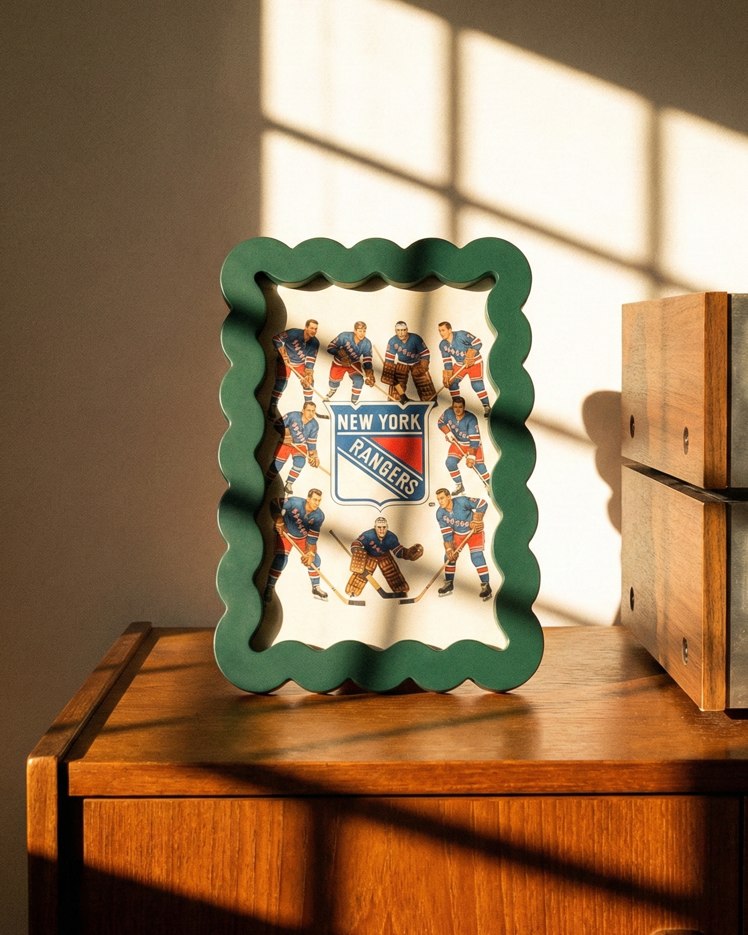 Framed picture of a hockey team on a wooden surface with vintage radio in the background