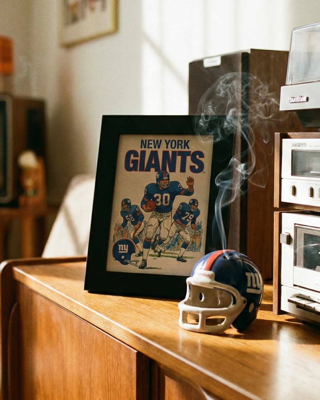 Vintage New York Giants poster and helmet on a wooden surface with retro stereo equipment.