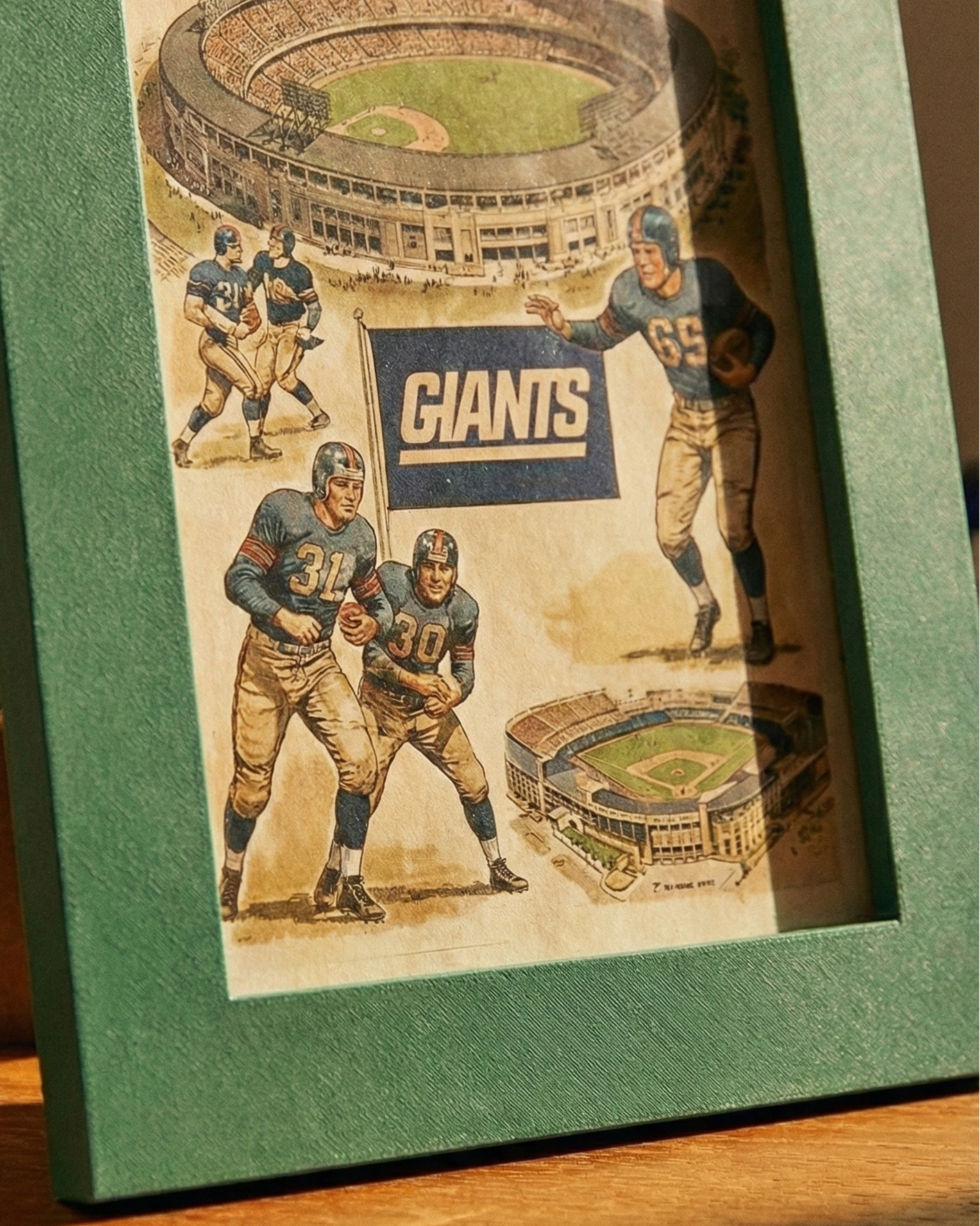 Framed New York Giants poster with vintage-style illustration of players and stadium.