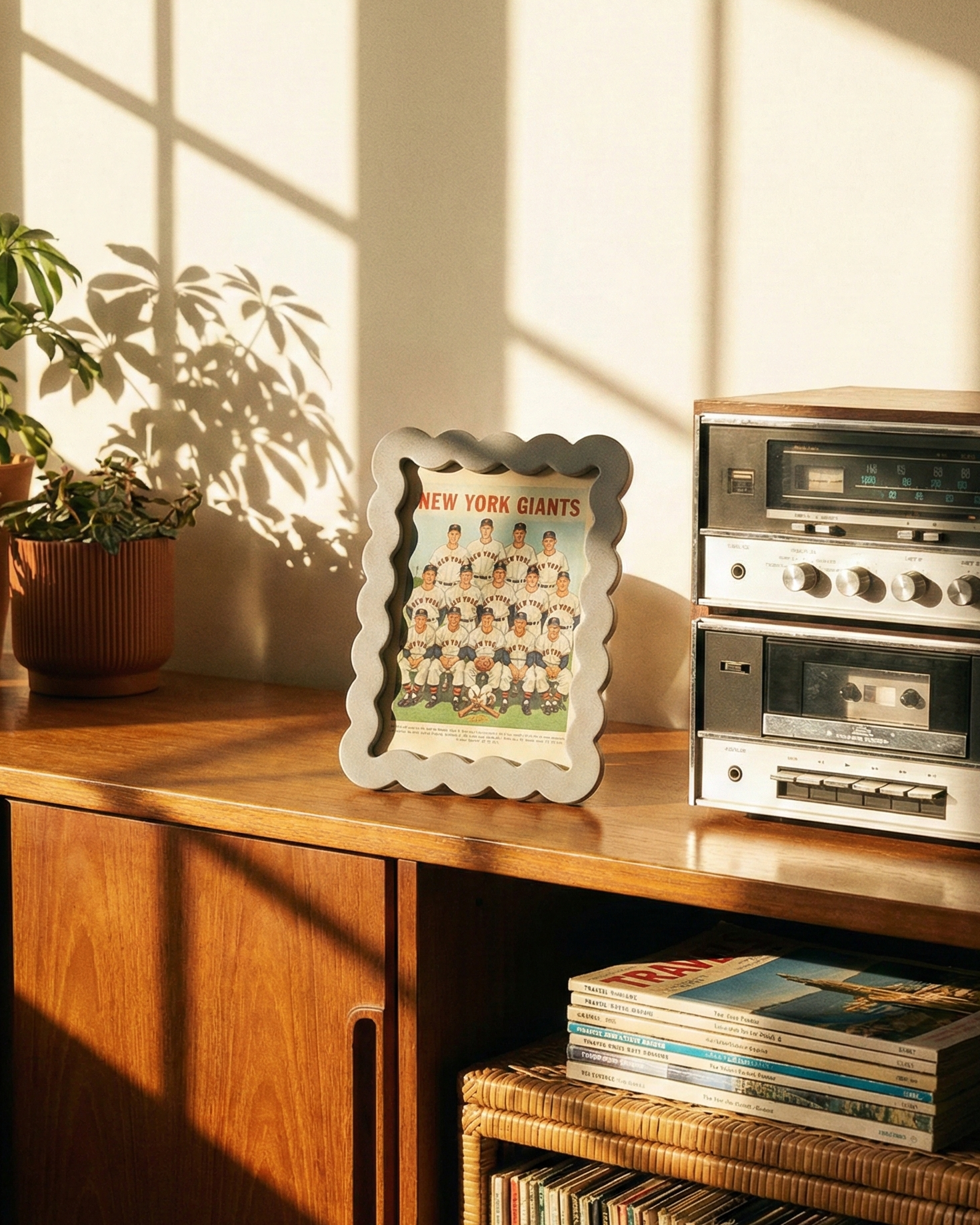 Wooden shelf with vinyl records, a framed photo, and an old radio player in a sunlit room.