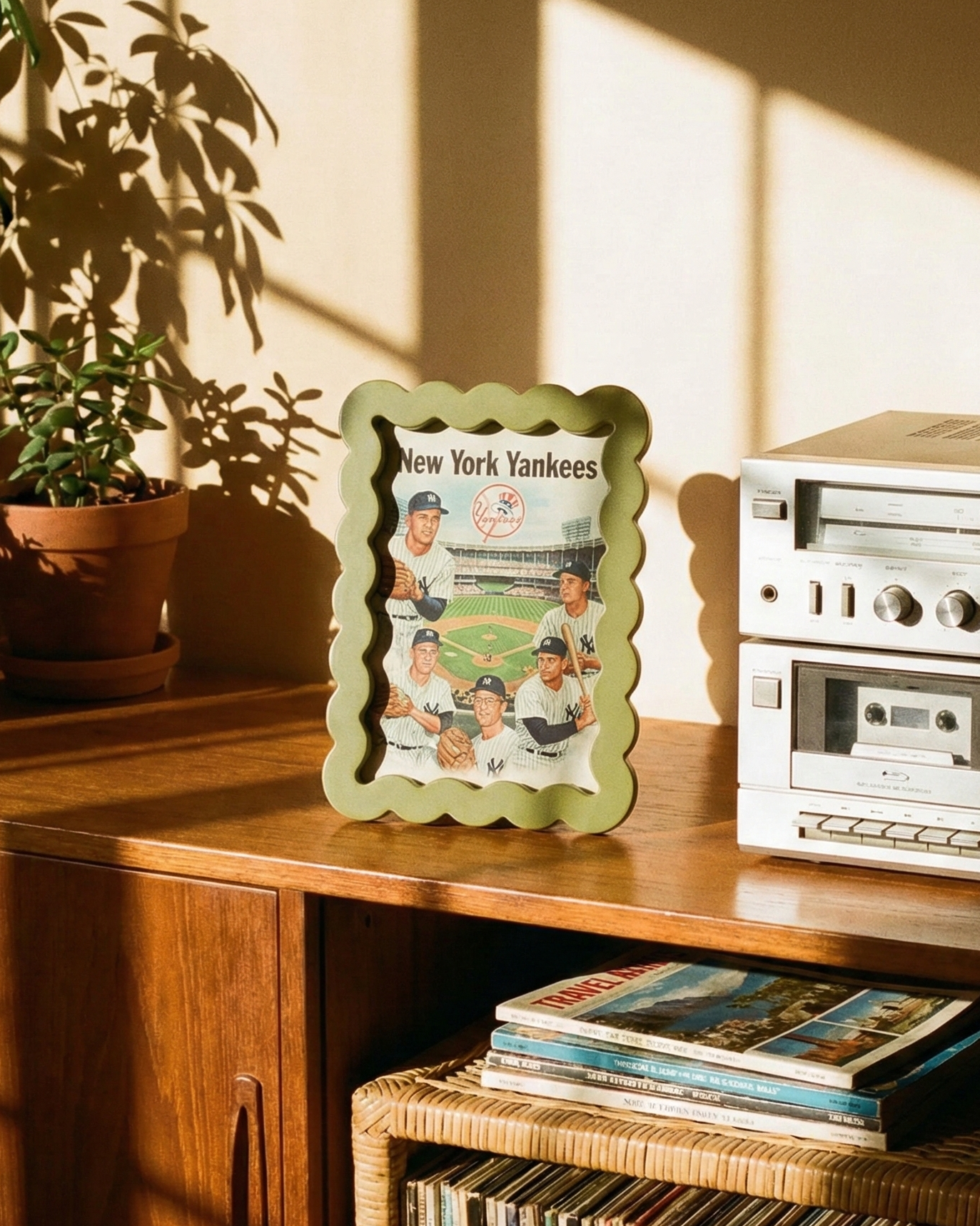 Vintage stereo equipment with a framed photo of New York Yankees on a wooden shelf.